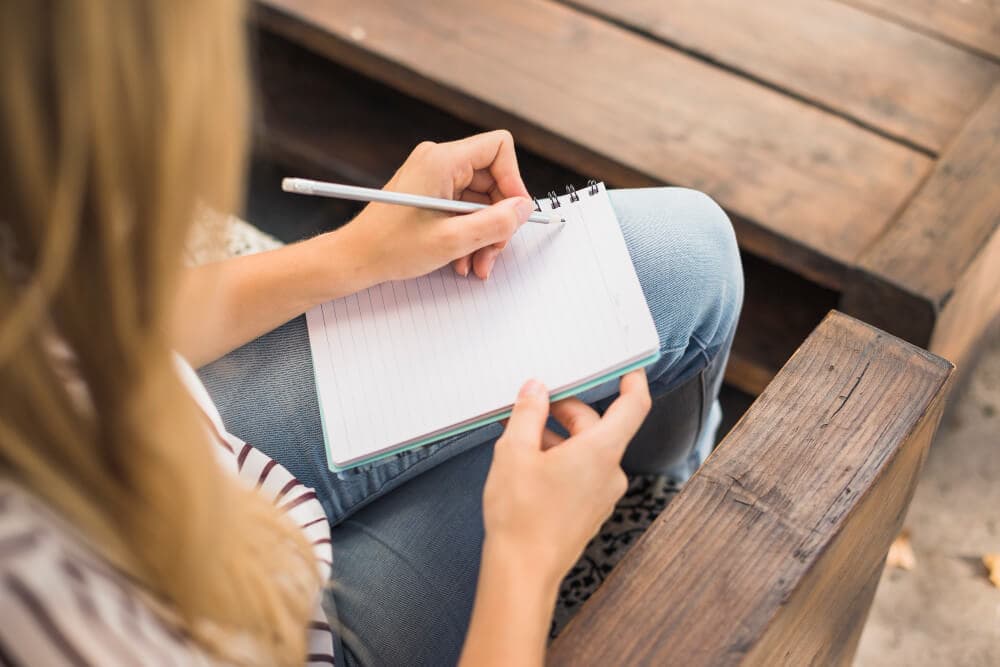 A person with Type 1 Diabetes logging their meal and insulin dosing information to improve their control.