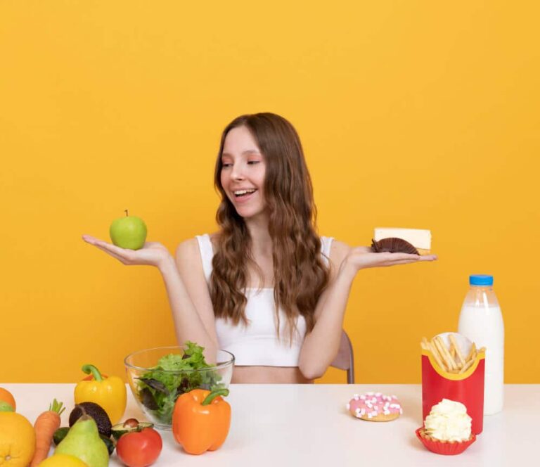 A person deciding between a low-carb diet and a moderate-carb diet for their Type 1 Diabetes management.