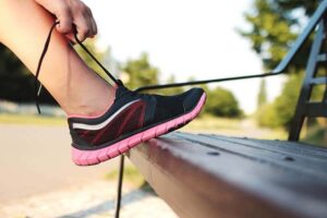 A person with Type 1 Diabetes preparing for exercise by checking their CGM.