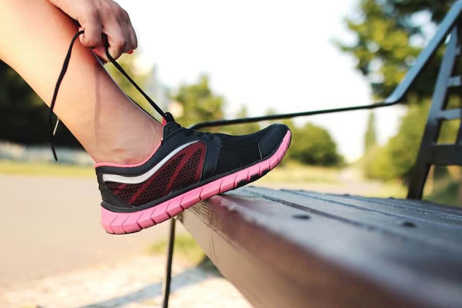 A person with Type 1 Diabetes preparing for exercise by checking their CGM.